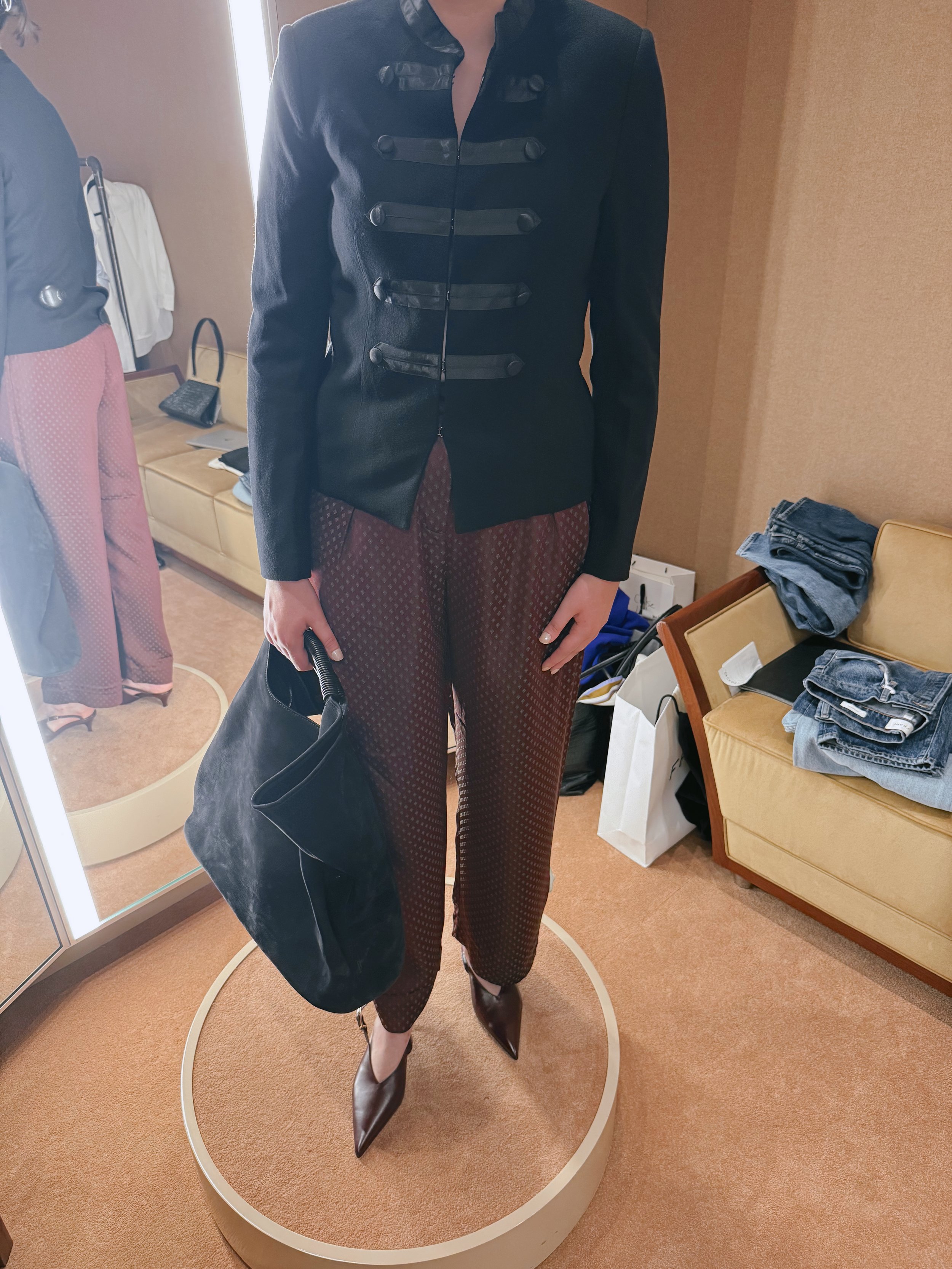 women styled in unique button shirt and patterned brown silk trousers