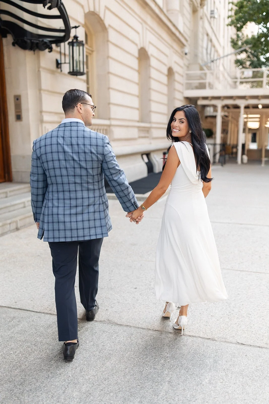 Engagement shoot styling with woman in a flowy white dress and cape collar with pointed toe lace heeled shoes
