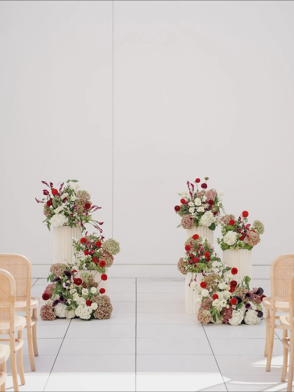Loved the color way of the local antique hydrangea, red ball dahlias with the yellow centers, moody hints of the deep toned calla lilies, and the lovely little clematis blooms flouncing away💛 

So happy to showcase some of the event spaces locally a