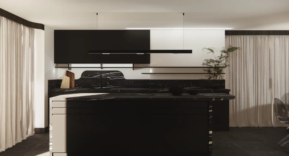 Marble island kitchen with curved backsplash, black cabinetry, warm lighting, and soft natural textures.