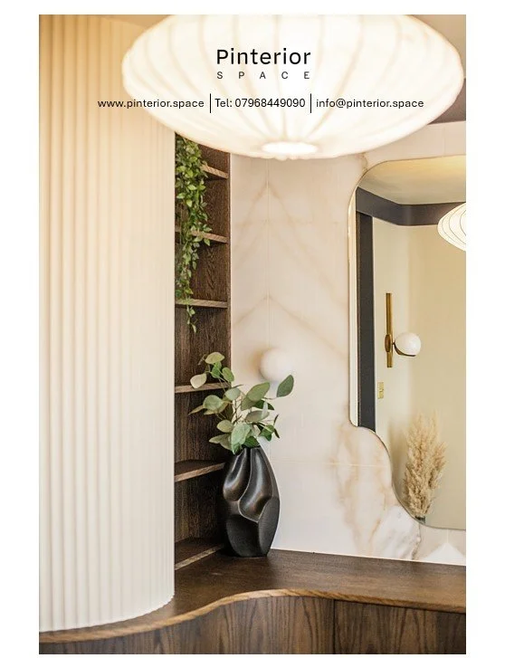 Bespoke curved dressing unit with layered storage and fluted wall in the Shelford interior design project