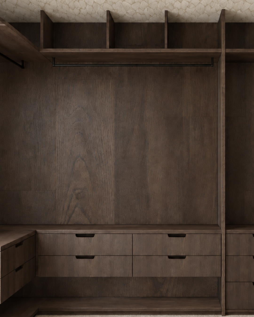 Part of a bespoke master bedroom walk-in wardrobe designed by Pinterior.space for a residential project in Water Lane, Cambridge. The dark timber joinery incorporates open upper compartments, hanging space and integrated drawers, with carefully consi