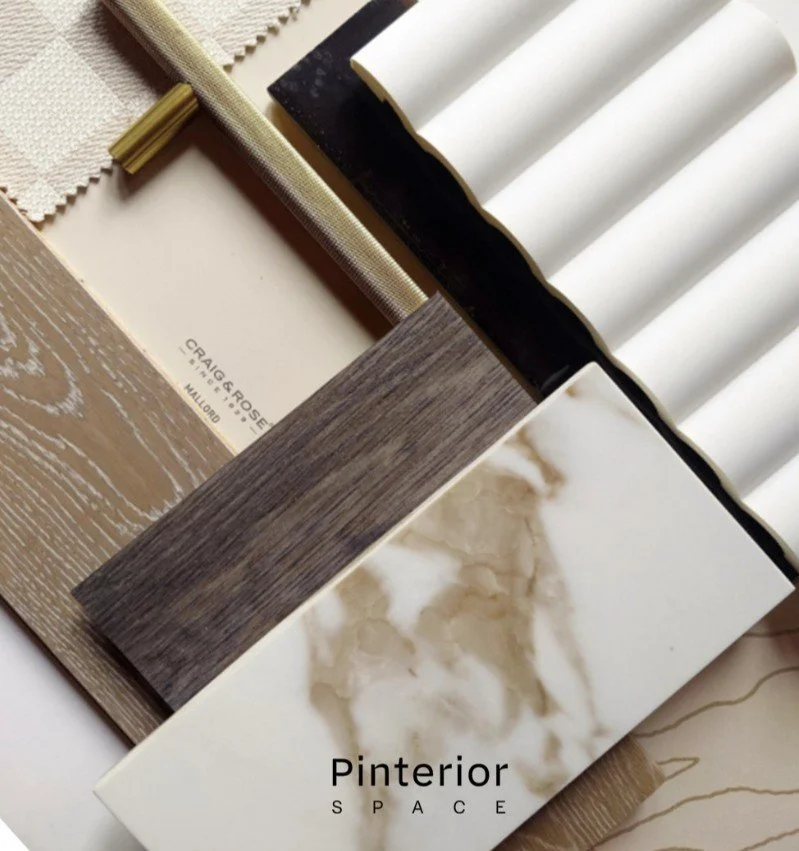 Sample board showcasing a harmonious material palette with fabrics, wood veneers, stone and brass for a contemporary interior design scheme.