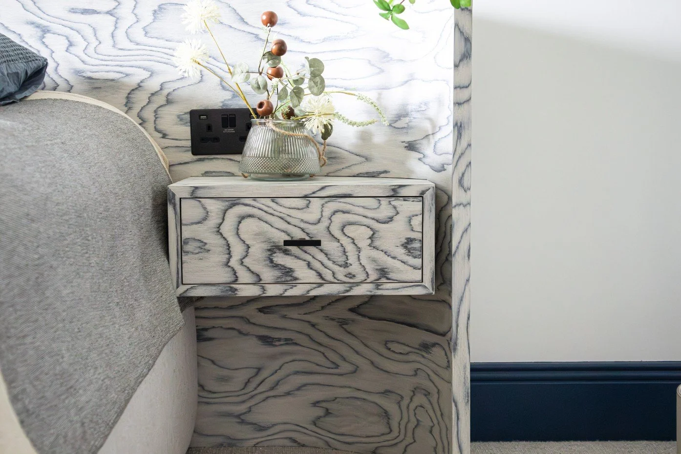 Cambridge bedroom with bespoke Sotsatts wood veneer headboard and floating nightstand.