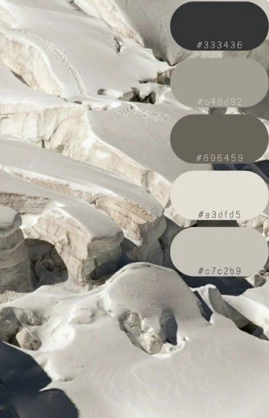 “Snow-covered glacial landscape with five sampled colour swatches in soft greys and beige tones — a natural palette for calm, grounded interiors.