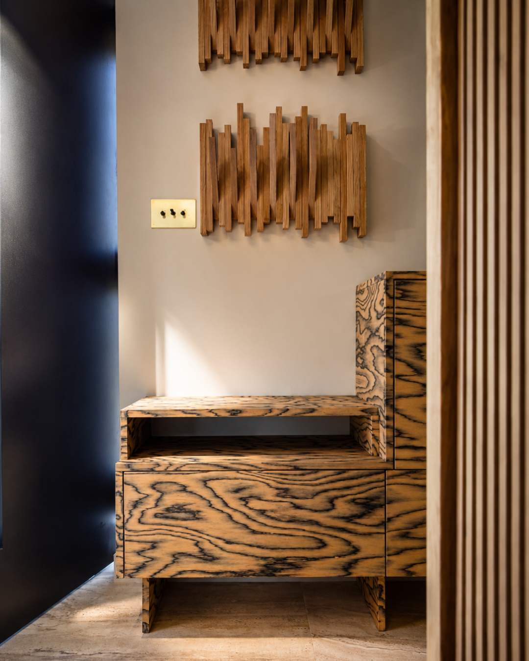 Bespoke hallway storage designed by Pinterior.space for the Shelford Project, featuring a custom shoe unit and sculptural wooden wall hooks designed to combine everyday functionality with crafted detail.