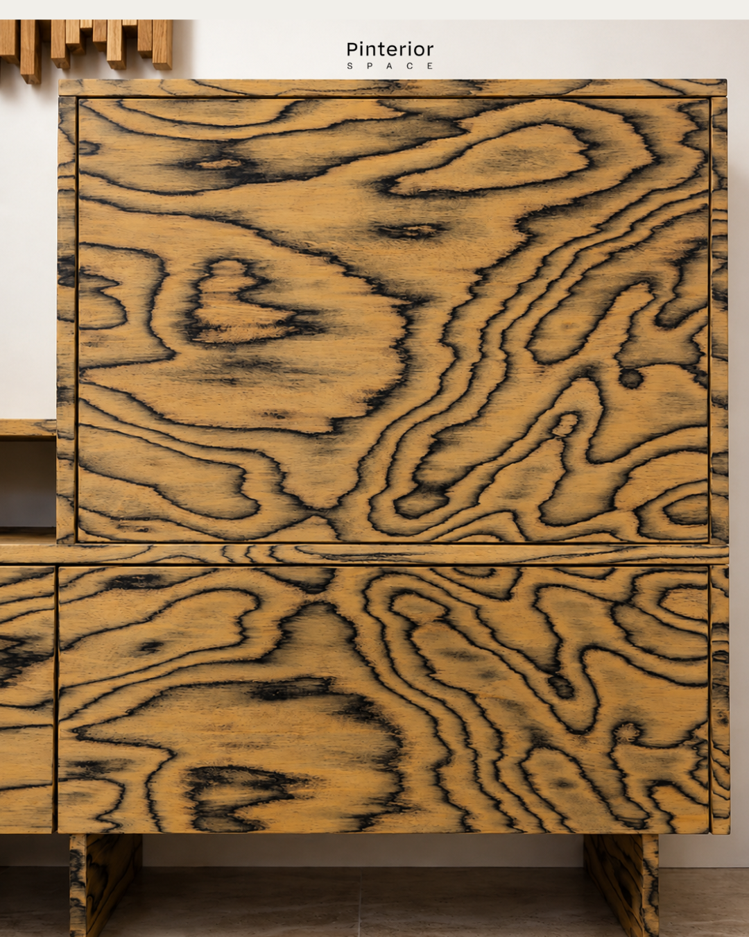 Detail of the bespoke hallway storage designed by Pinterior.space for the Shelford Project, using expressive timber grain and integrated cabinetry to create a functional statement piece within the entrance hall.
