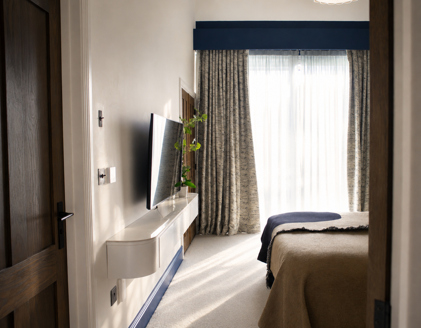 Award-winning interior design for a master bedroom at our Water Lane project in Cambridge, featuring bespoke joinery, contemporary furnishings, natural materials and thoughtfully layered lighting to create a calm and timeless retreat.