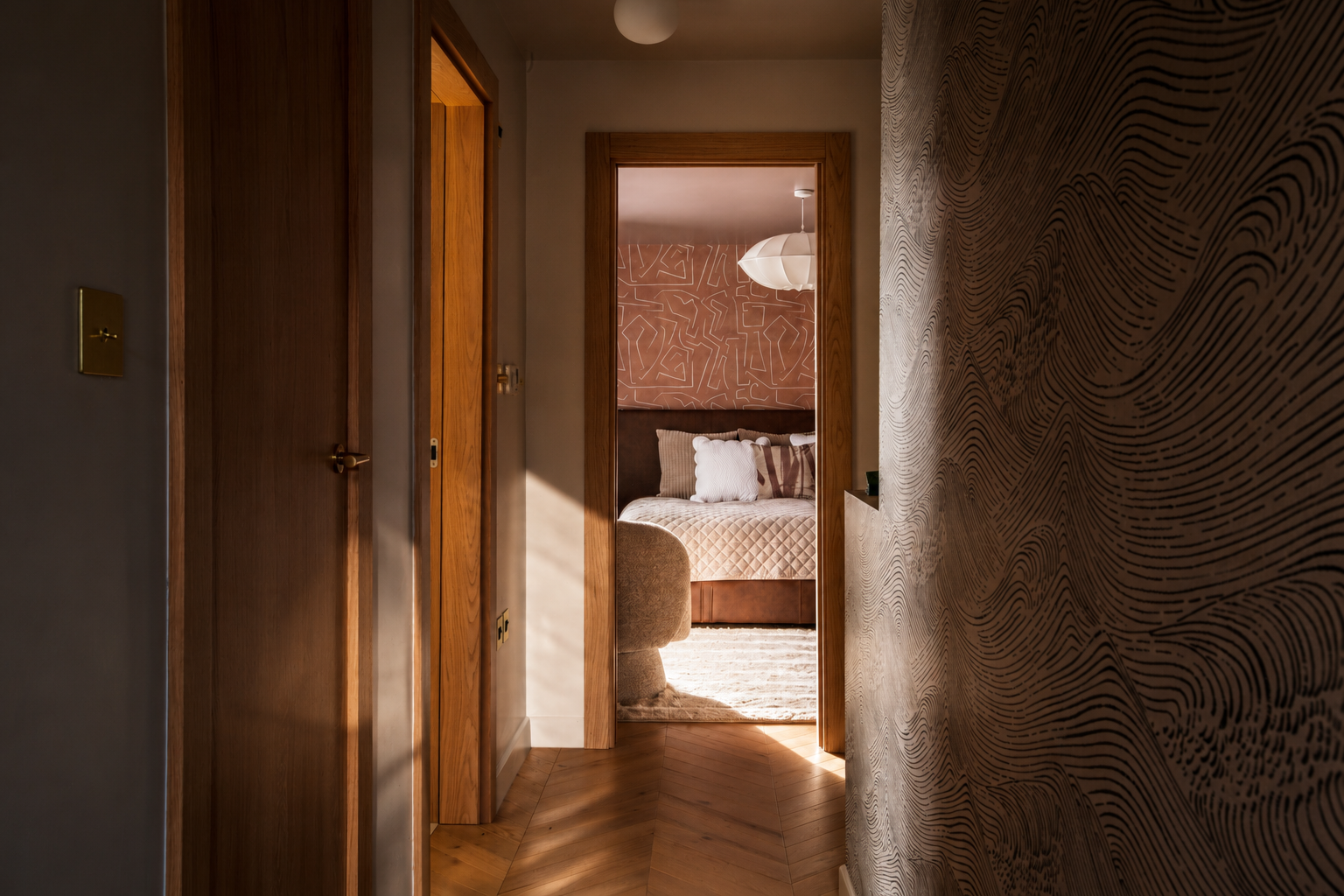 A warm contemporary hallway designed for a residential project in Great Shelford, Cambridge. Natural light, textured wall finishes and layered materials create a calm transition between spaces while reinforcing the overall design narrative of the hom