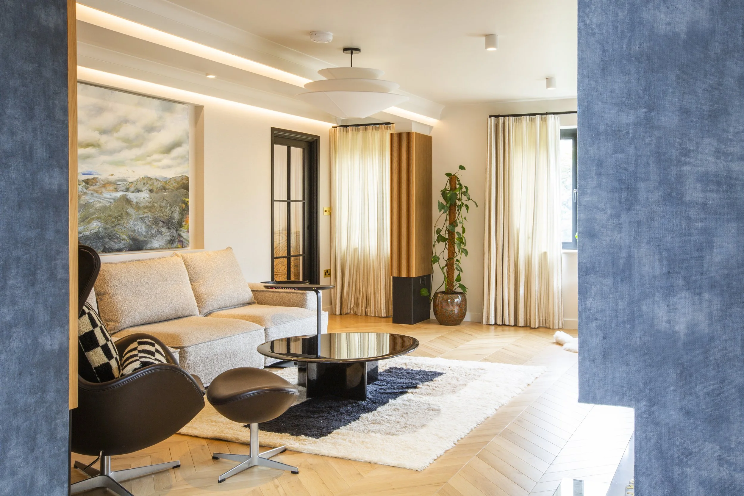 Scandinavian-inspired living room in a Cambridge home, with layered textures, soft neutrals, and natural light