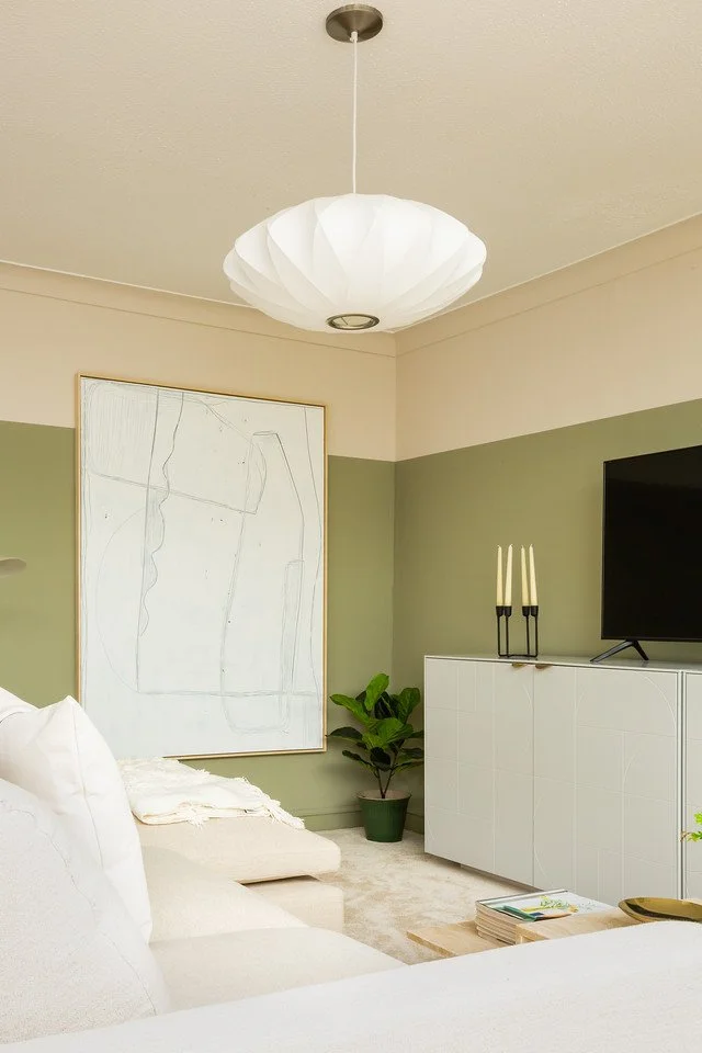 Closed freestanding storage in the Gamlingay living room, featuring a modern white cabinet, soft neutral palette and contemporary styling for a calm, organised space.