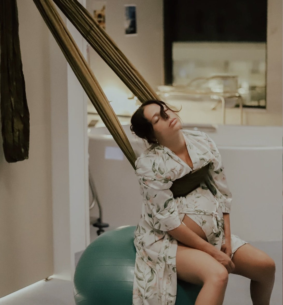 Pregnant woman using a birth sling in hospital during labour – available to hire across Australia