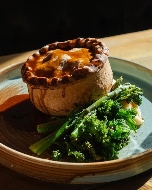 Celebrate British Pie Week with us 🥧

Hand Crafted Slow Braised Beef &amp; Ale Pie: tender slow-cooked beef in shortcrust pastry, served with creamy mash, heritage carrots, tenderstem broccoli, buttered cabbage and roasting gravy.

Served Monday&nda