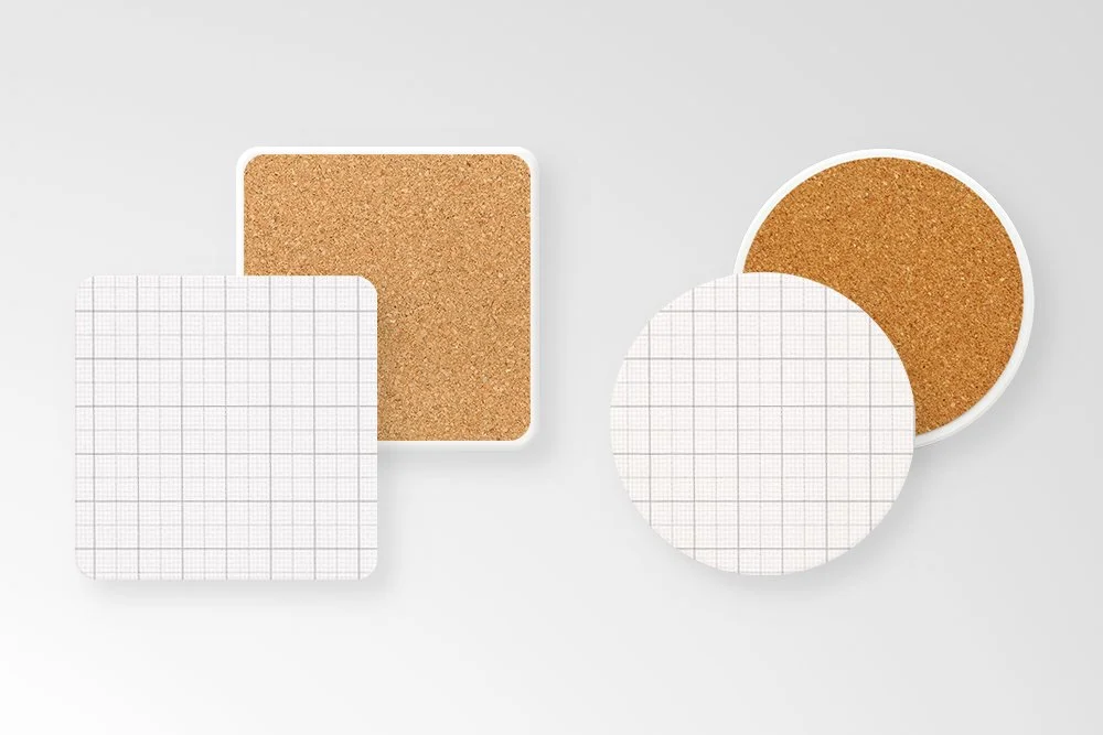 Set of four coasters, two square and two round, featuring cork backing and grid pattern on the top surface.