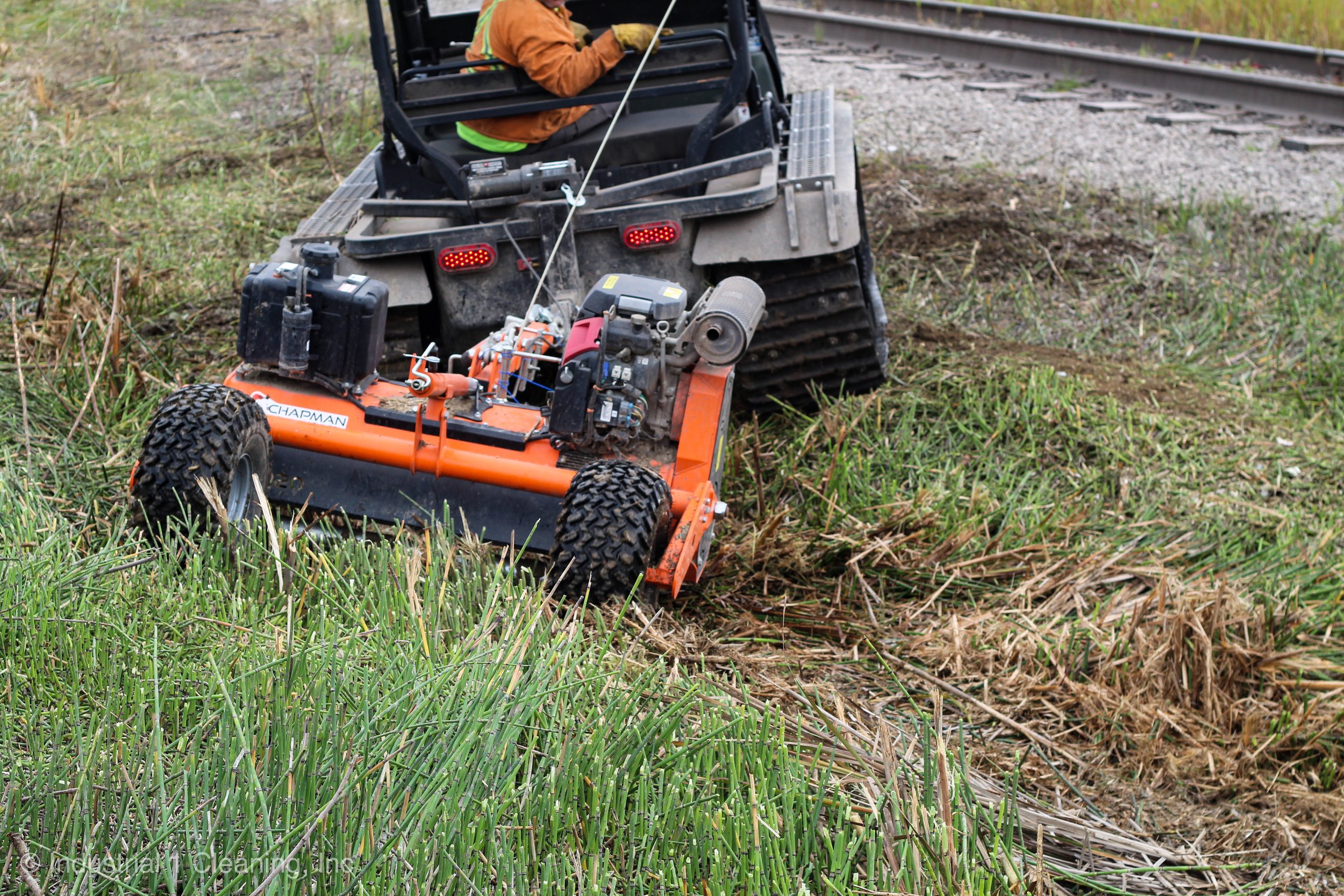 Cutting grass using flail mower