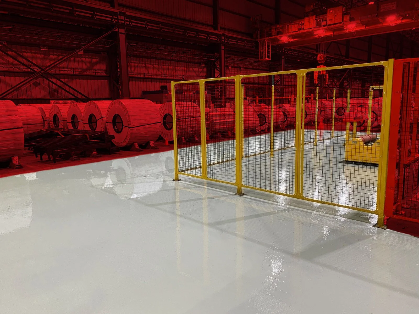 Industrial facility with a shiny gray epoxy floor.