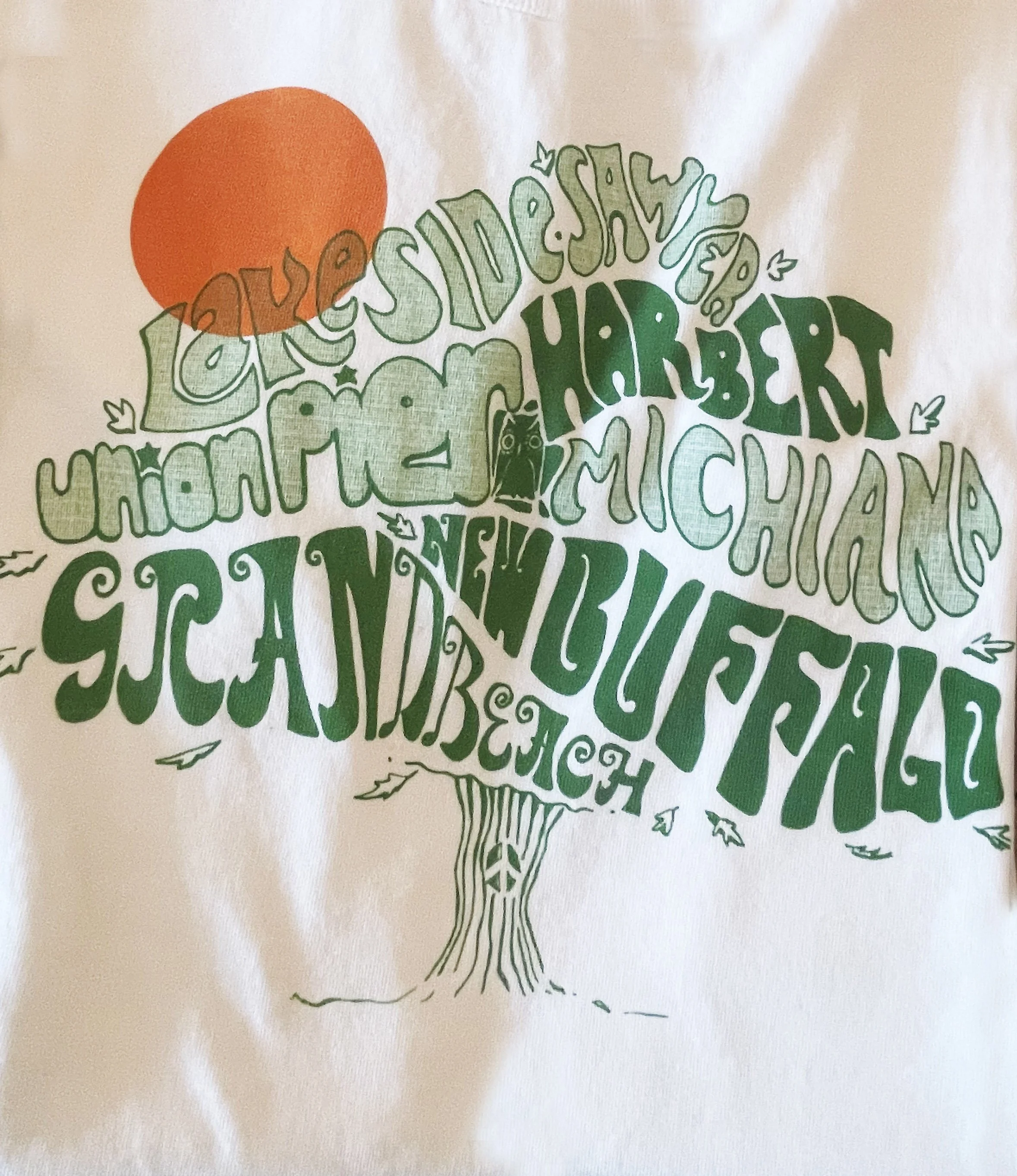 Graphic illustration of a tree made of words of a list of cities and states, with an orange sun in the top left corner of the image.