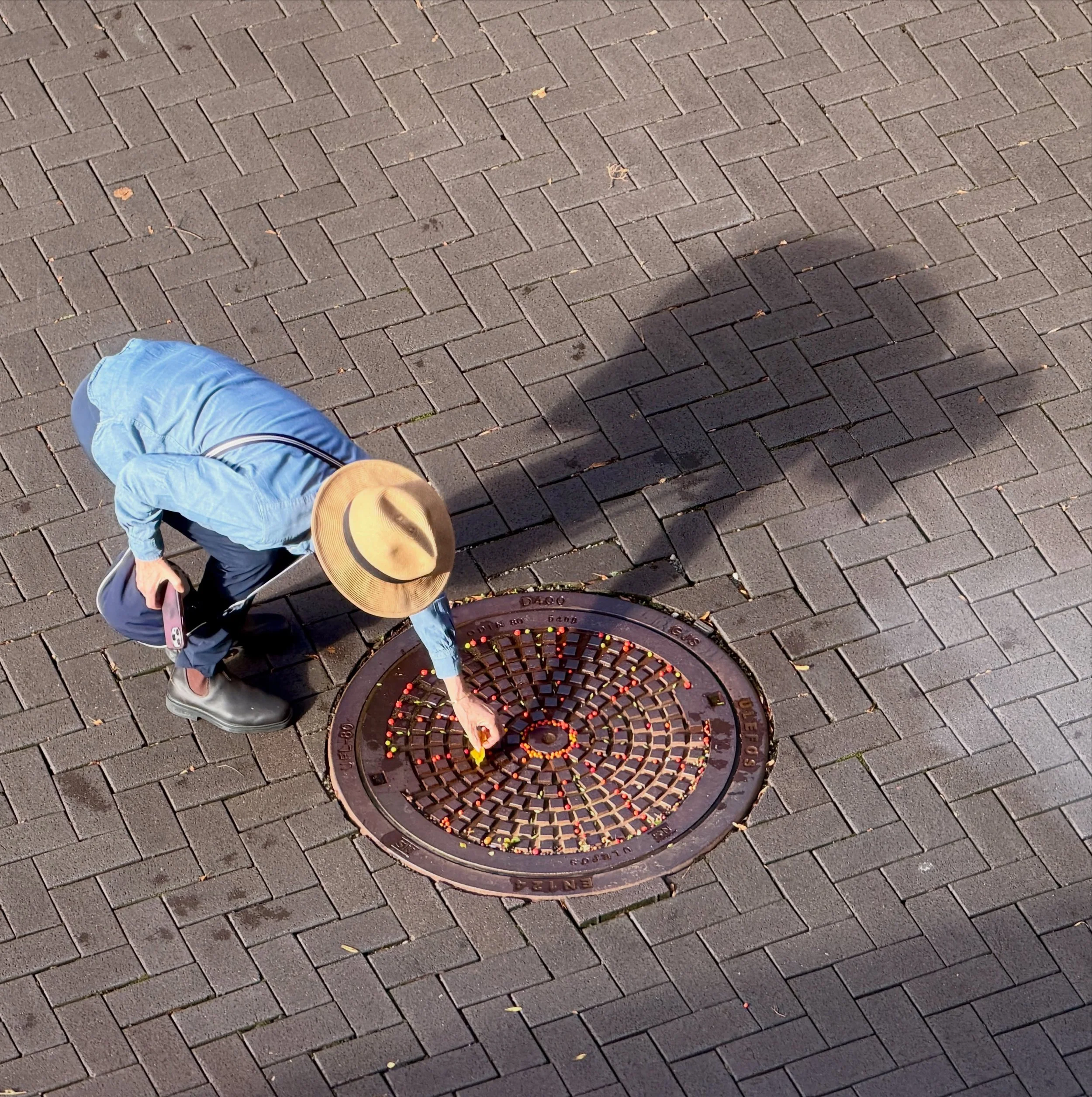 More berries! Not exactly by public demand, I kept working on our hotel manhole cover in Stavanger, Norway. Unbeknownst to me, my husband photographed me from our room. #dogwalkdiarynyc #stavangerstreetart #manholecover #manholecoversoftheworld #manh