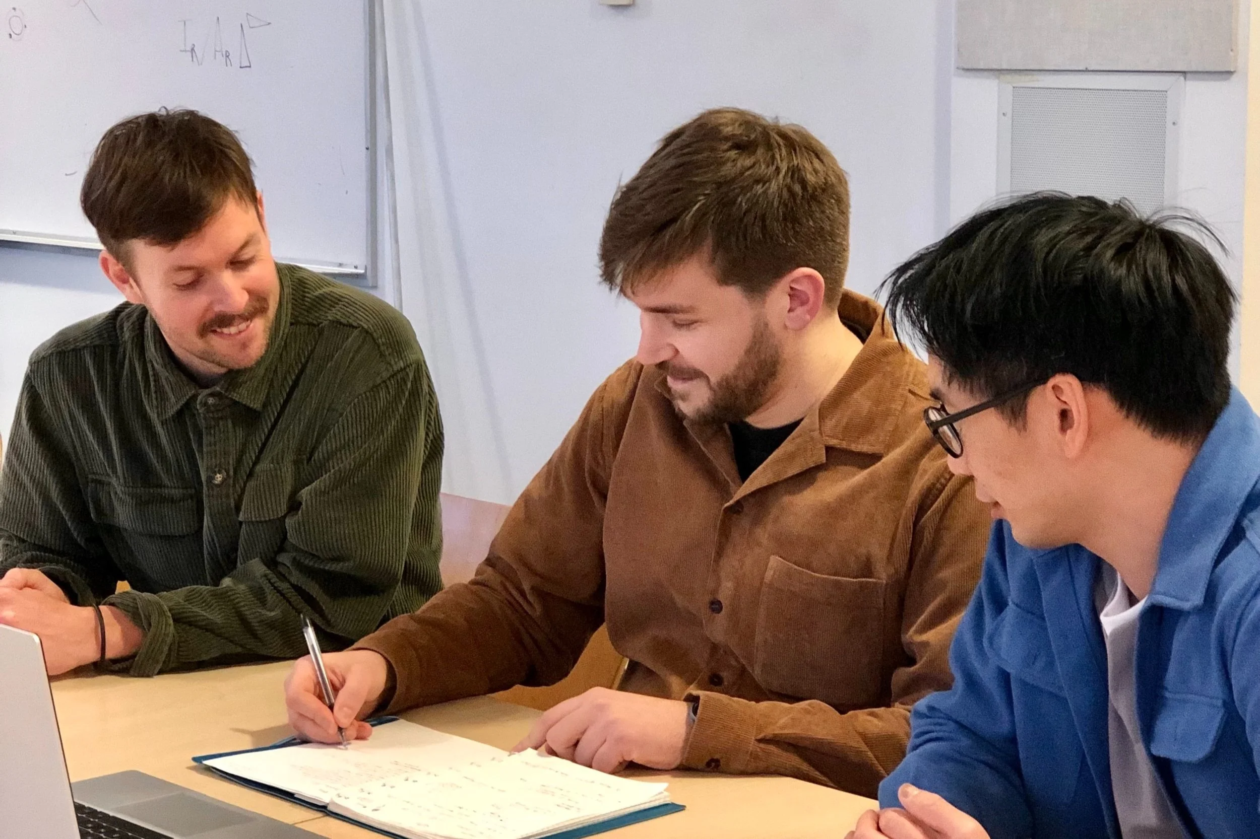 Two people consulting with a client