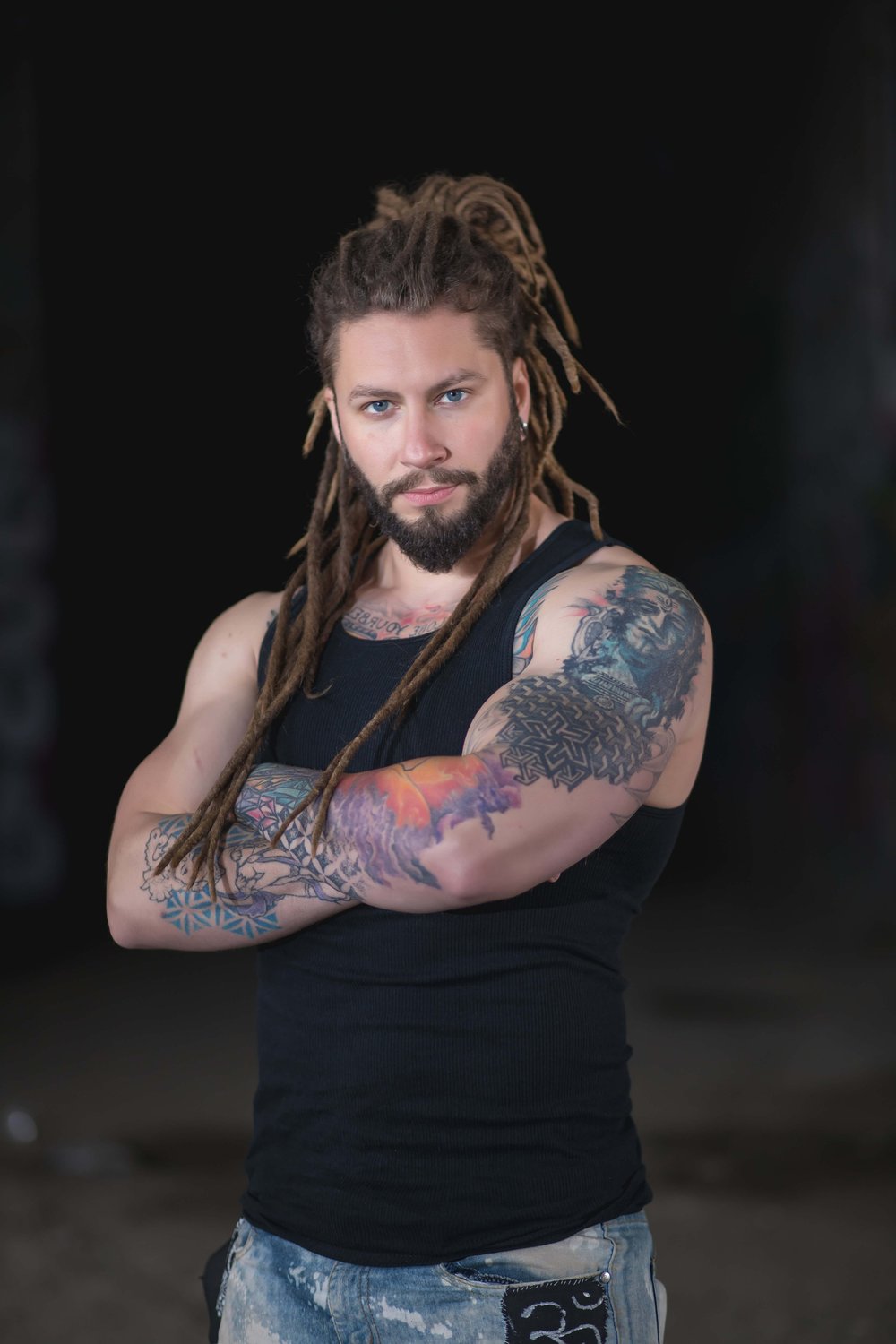 Tattooed man in a moody sensual branding portrait
