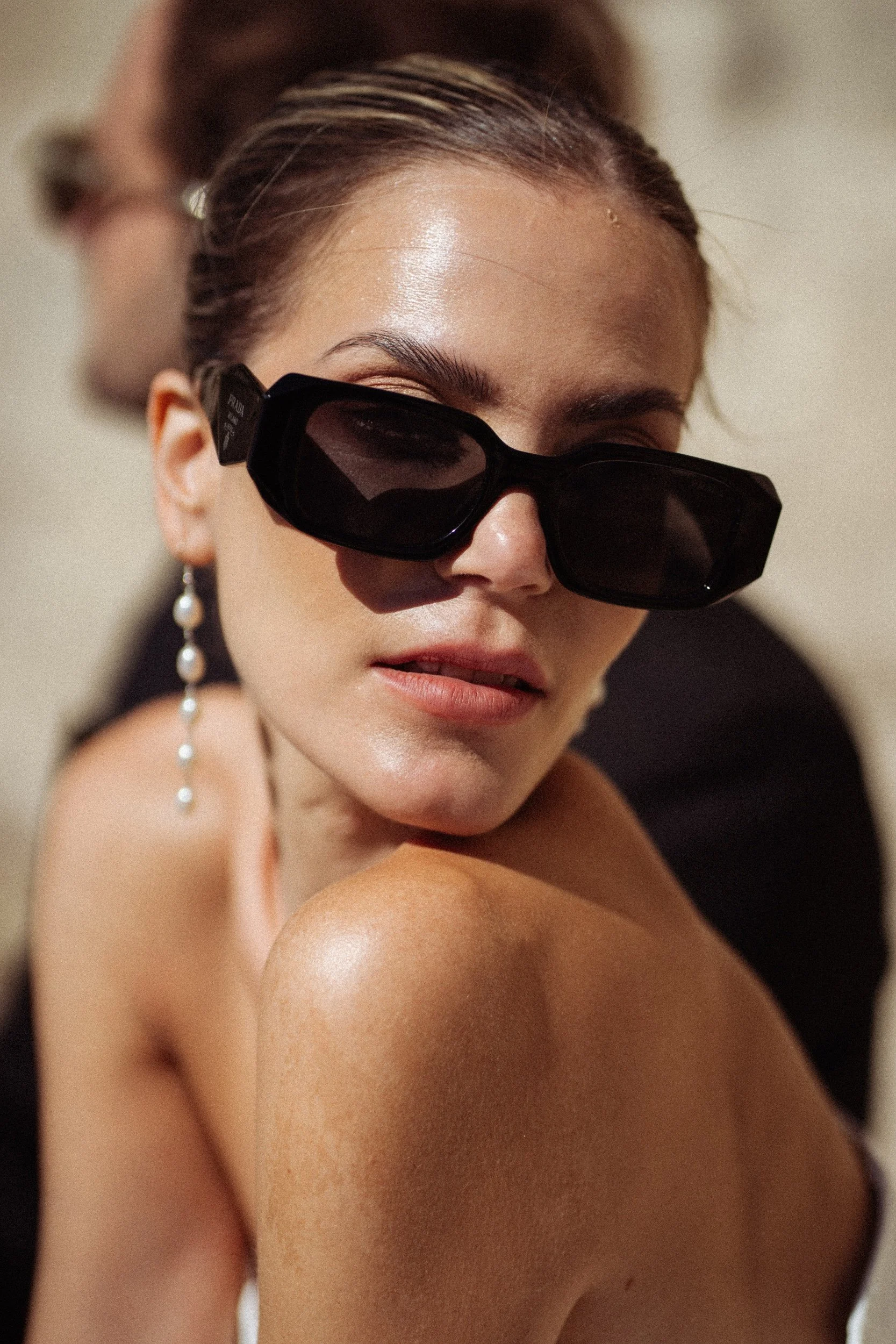 female fashion model wearing sunglasses.