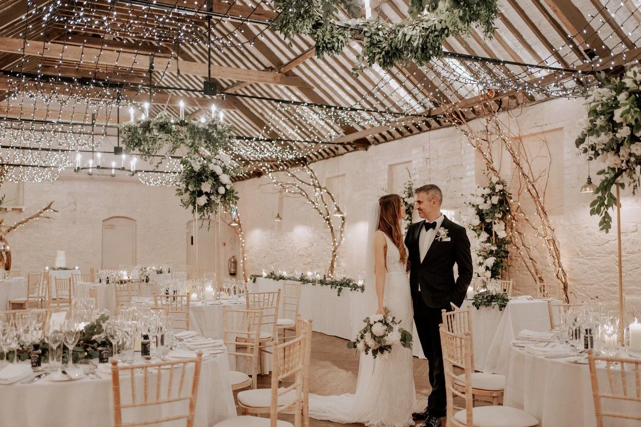 Bride and groom in the reception room of larchfield estate main house