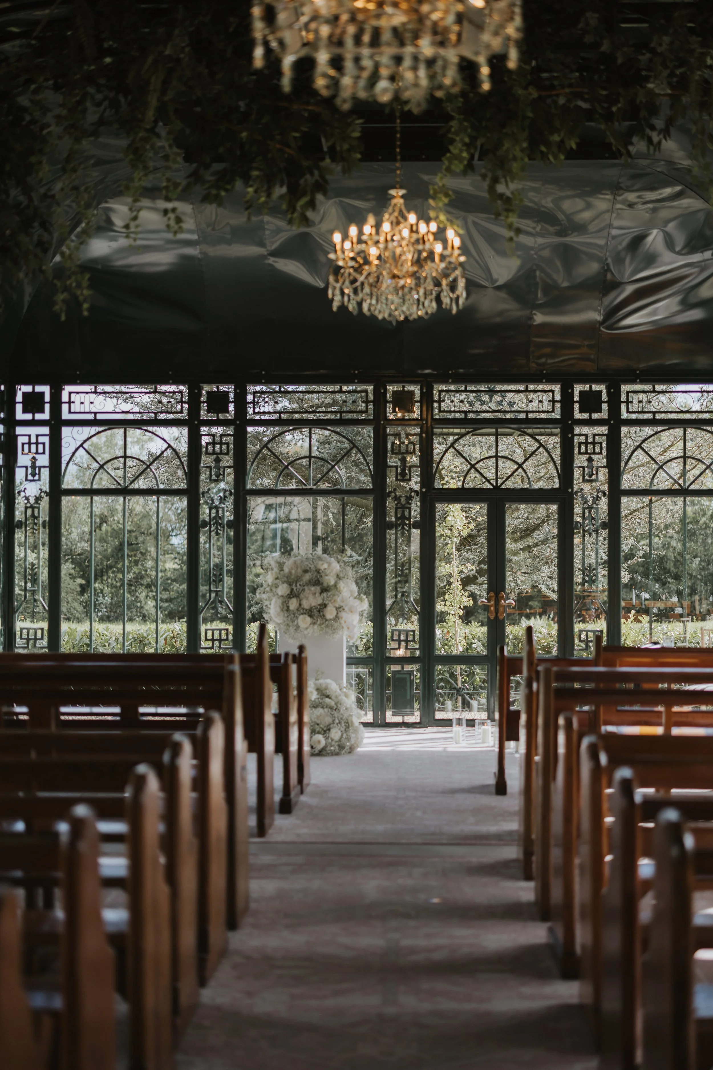ceremony space showing chandeliers and where the couple get married at the old rectory