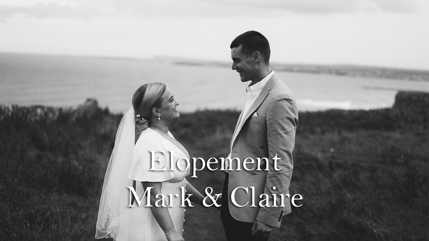 Photo of Bride and Groom facing each other during elopement at Benone Beach