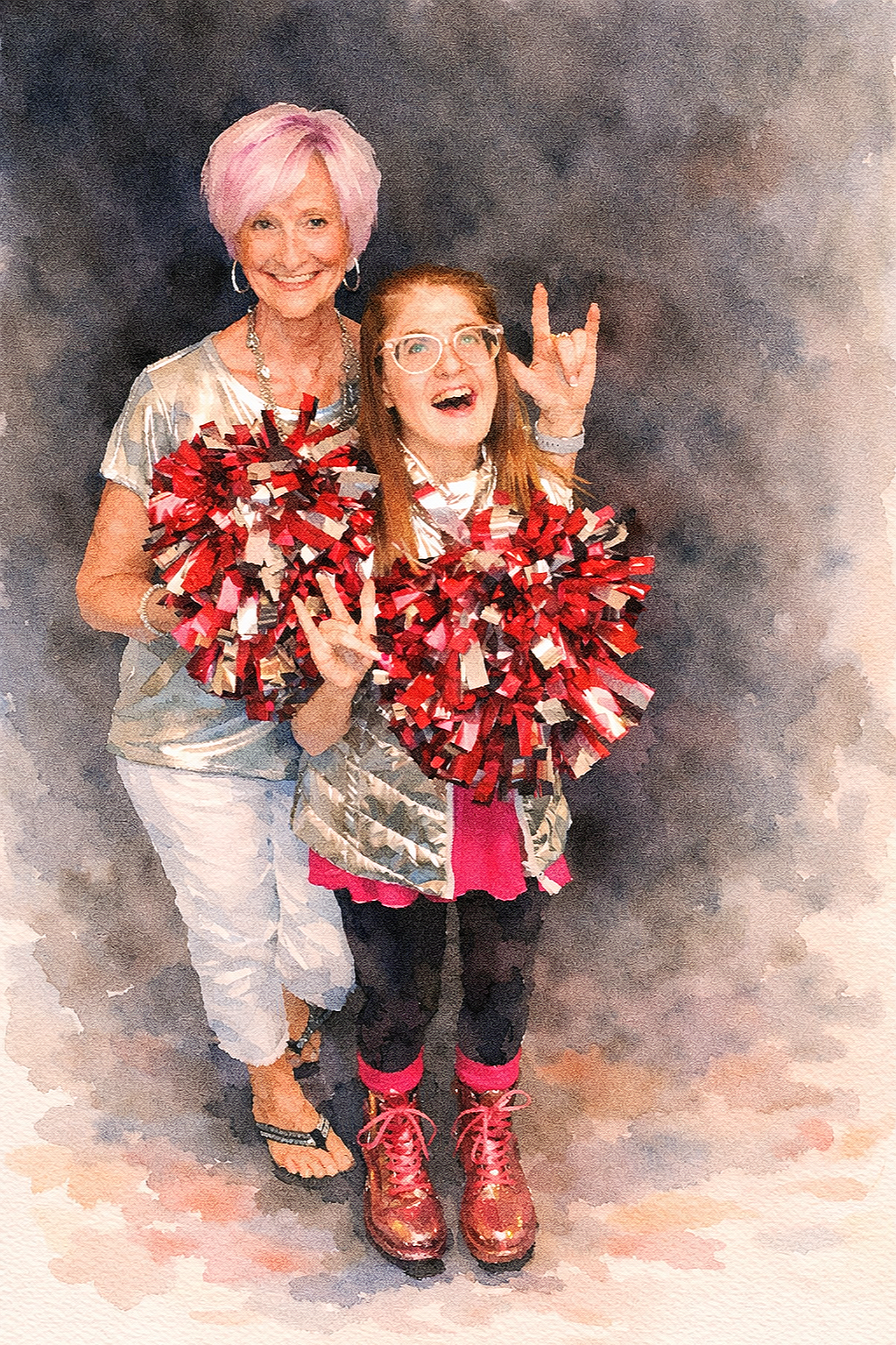 Two women smiling and holding red pom-poms, wearing cheerful clothing, one with pink hair signing I Love You in American Sign Language (ASL)  and the other with glasses and a Tracheostomy, in a studio with dark background.