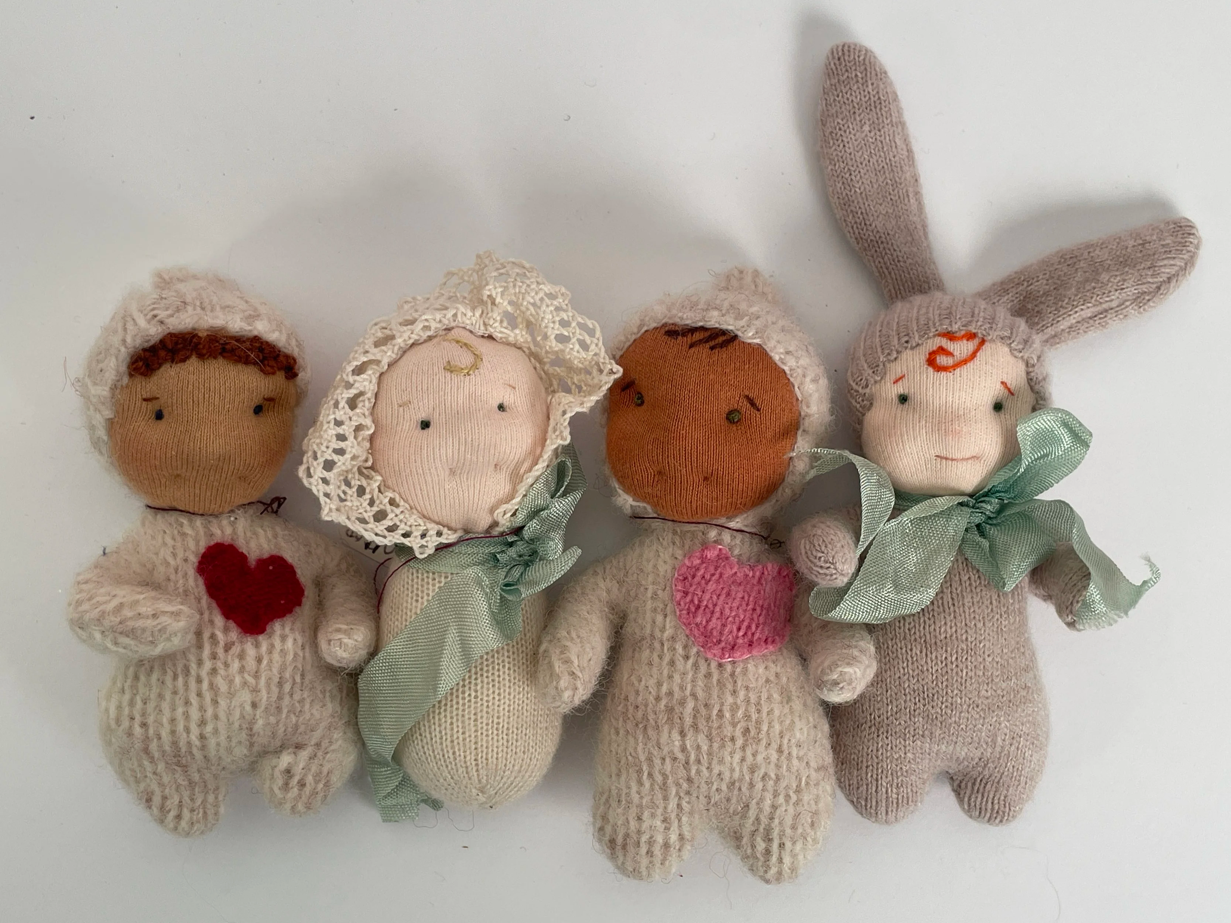 Handmade dolls from recycled wool sweaters. 3" tall.