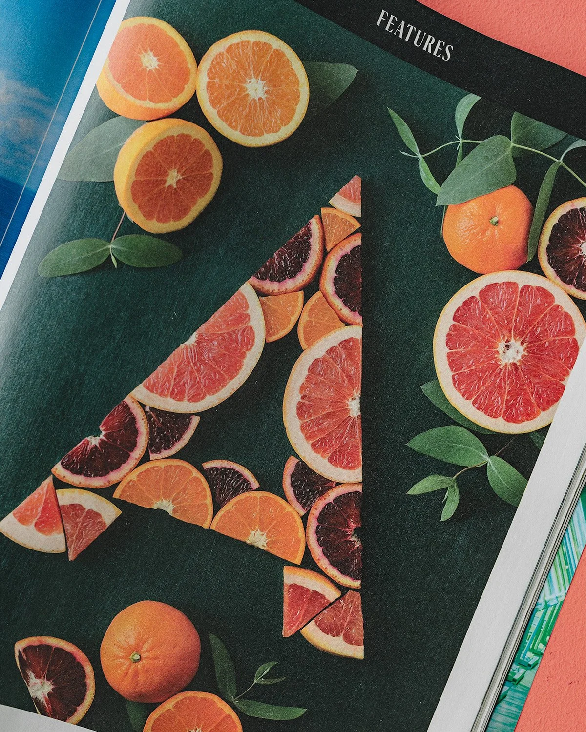 Close up of tearsheet of Lauren Hom's letter "A" made of citrus for Afar Magazine's Winter 2026 issue.