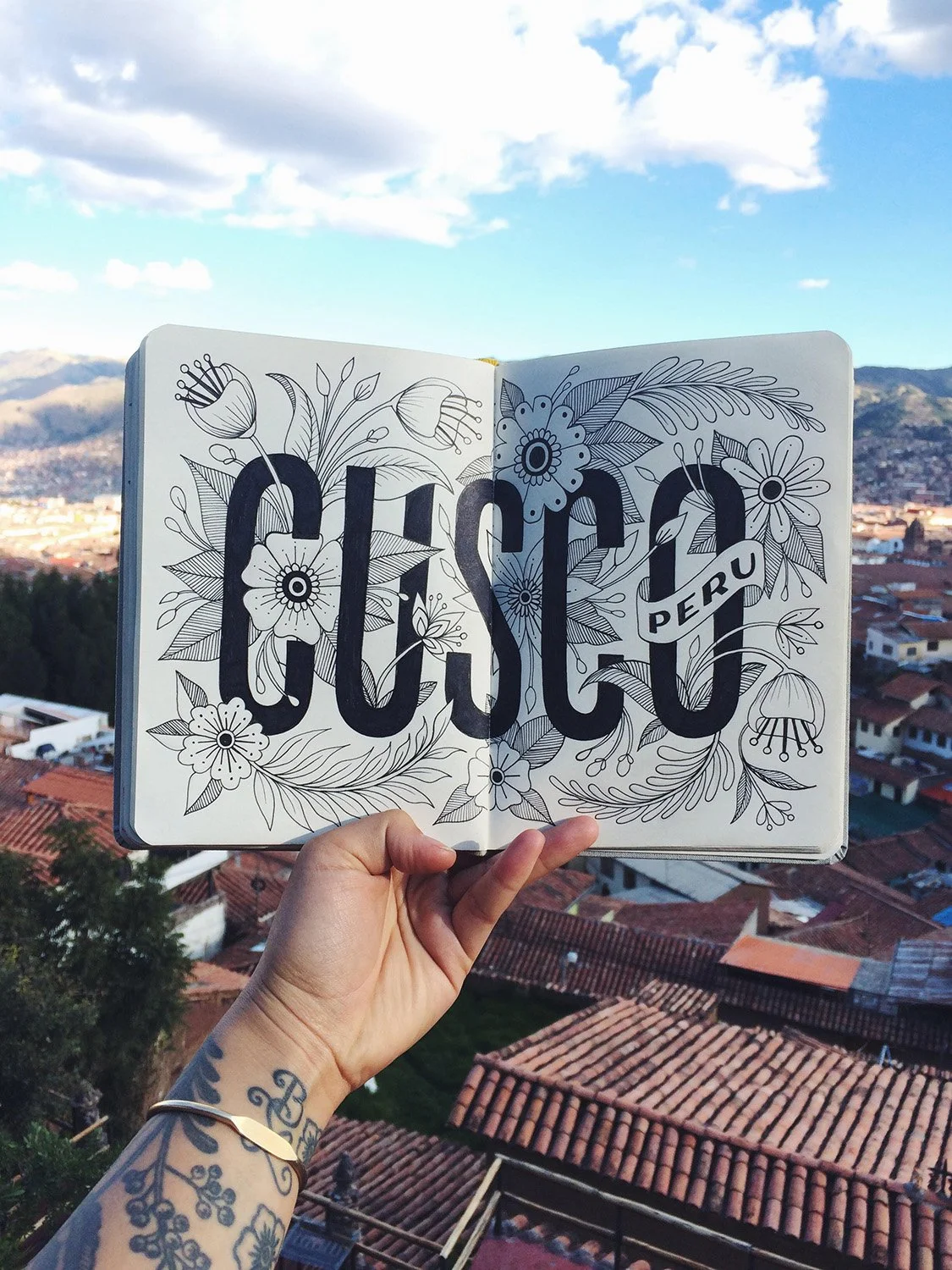 Ornate, floral sketchbook page reading "Cusco, Peru".