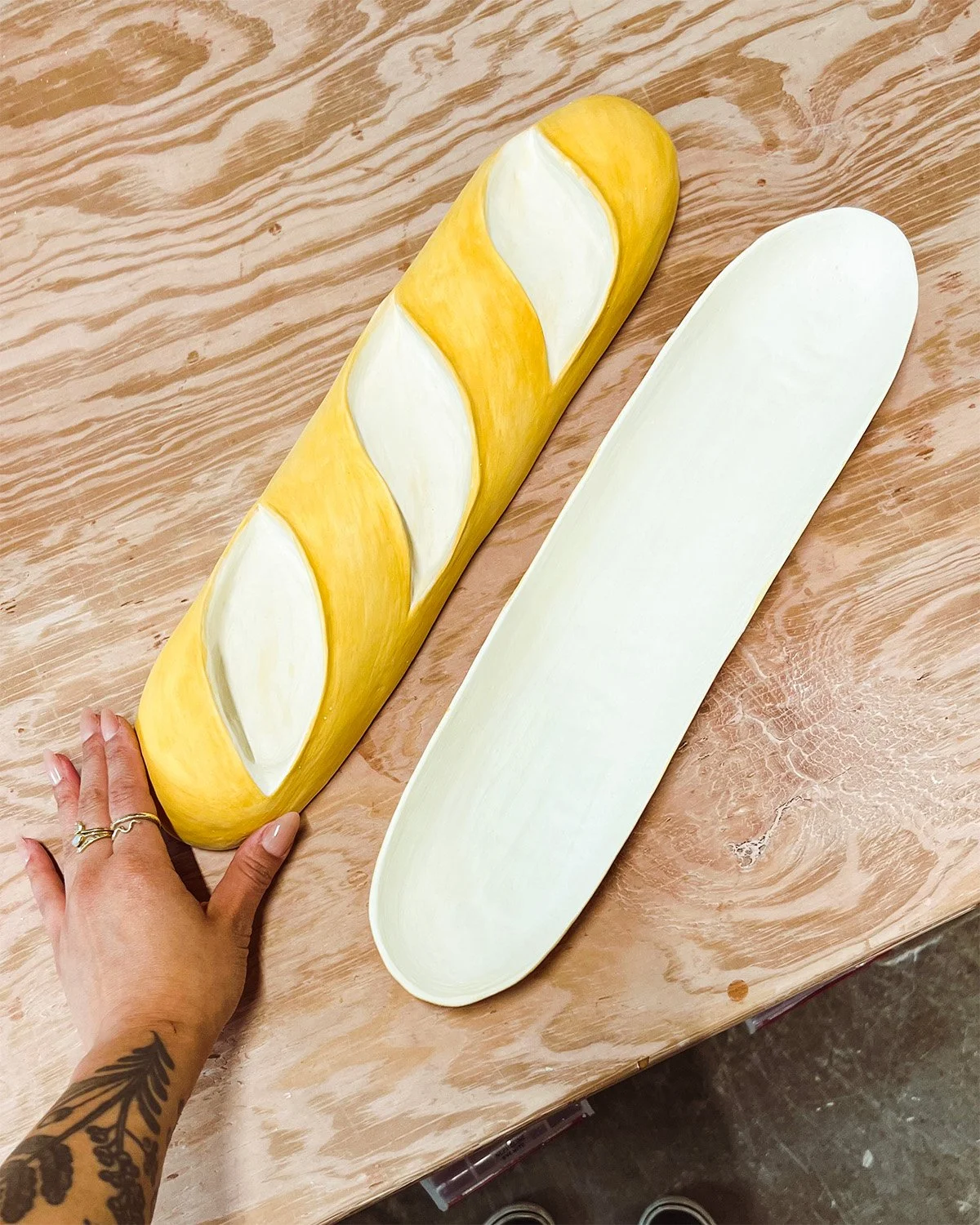 Open ceramic baguette serving dish process image.