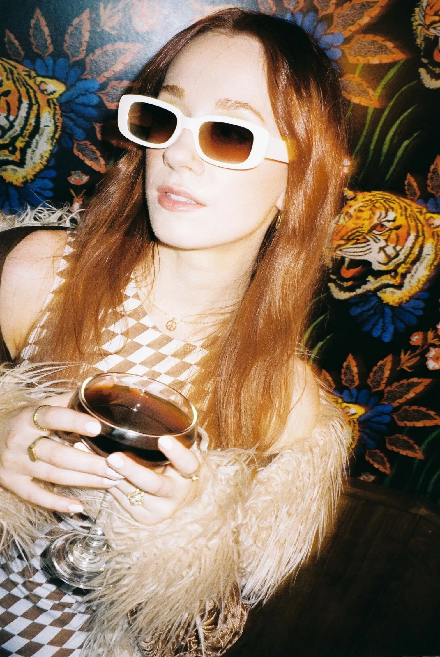 oman-in-sunglasses-holding-drink