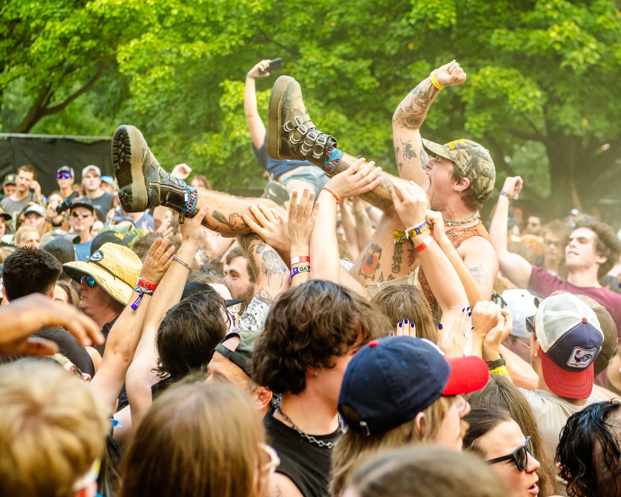 Crowd-surfing moment at Shaky Knees Music Festival in Atlanta, captured by music photographer Steph Cousino.