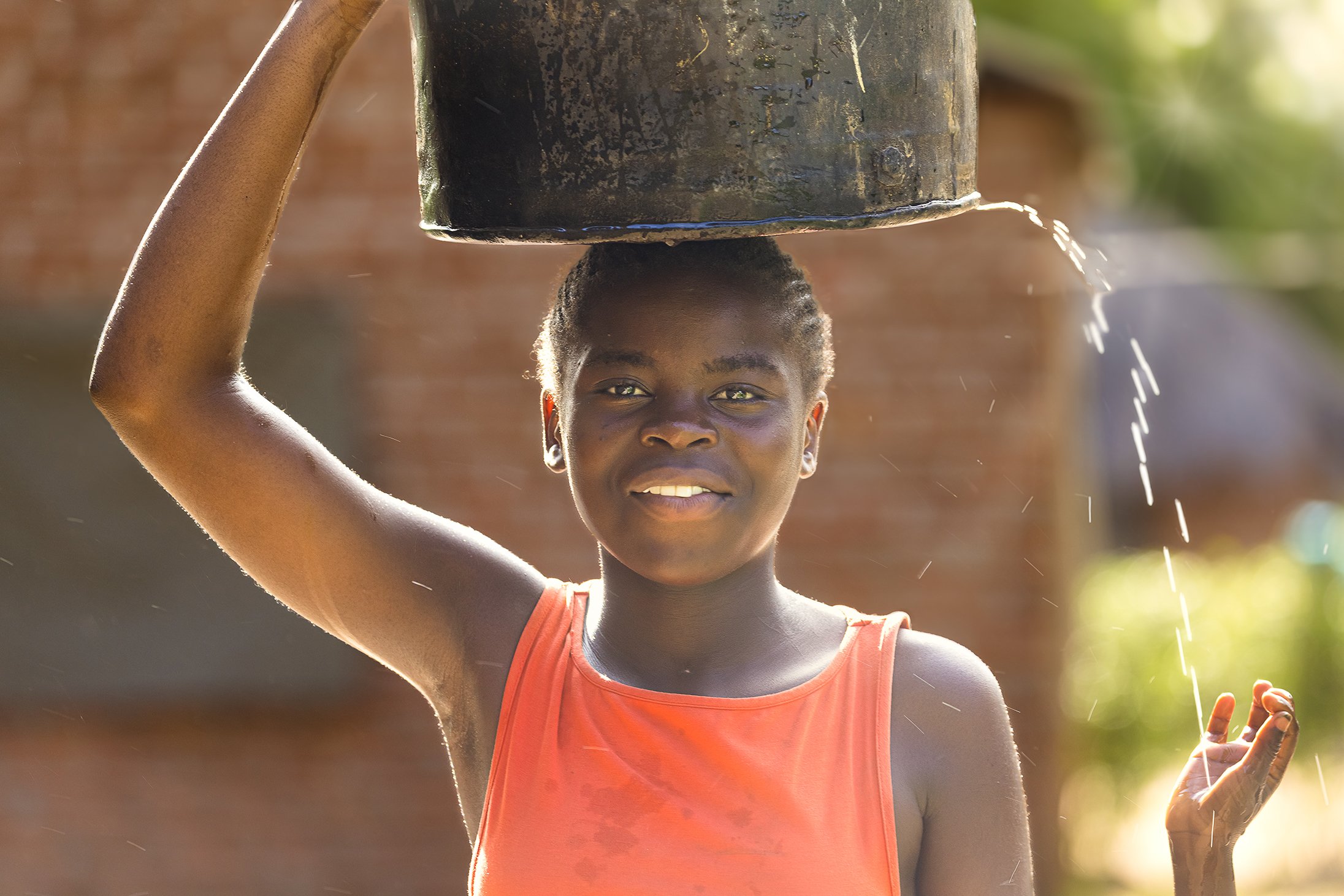 Girl with water bucket.jpg