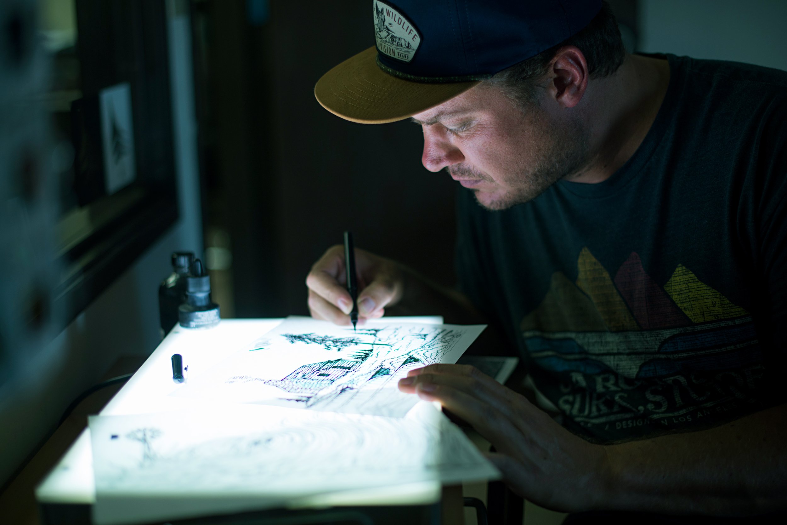 andrew drawing on lightbox spread.jpg