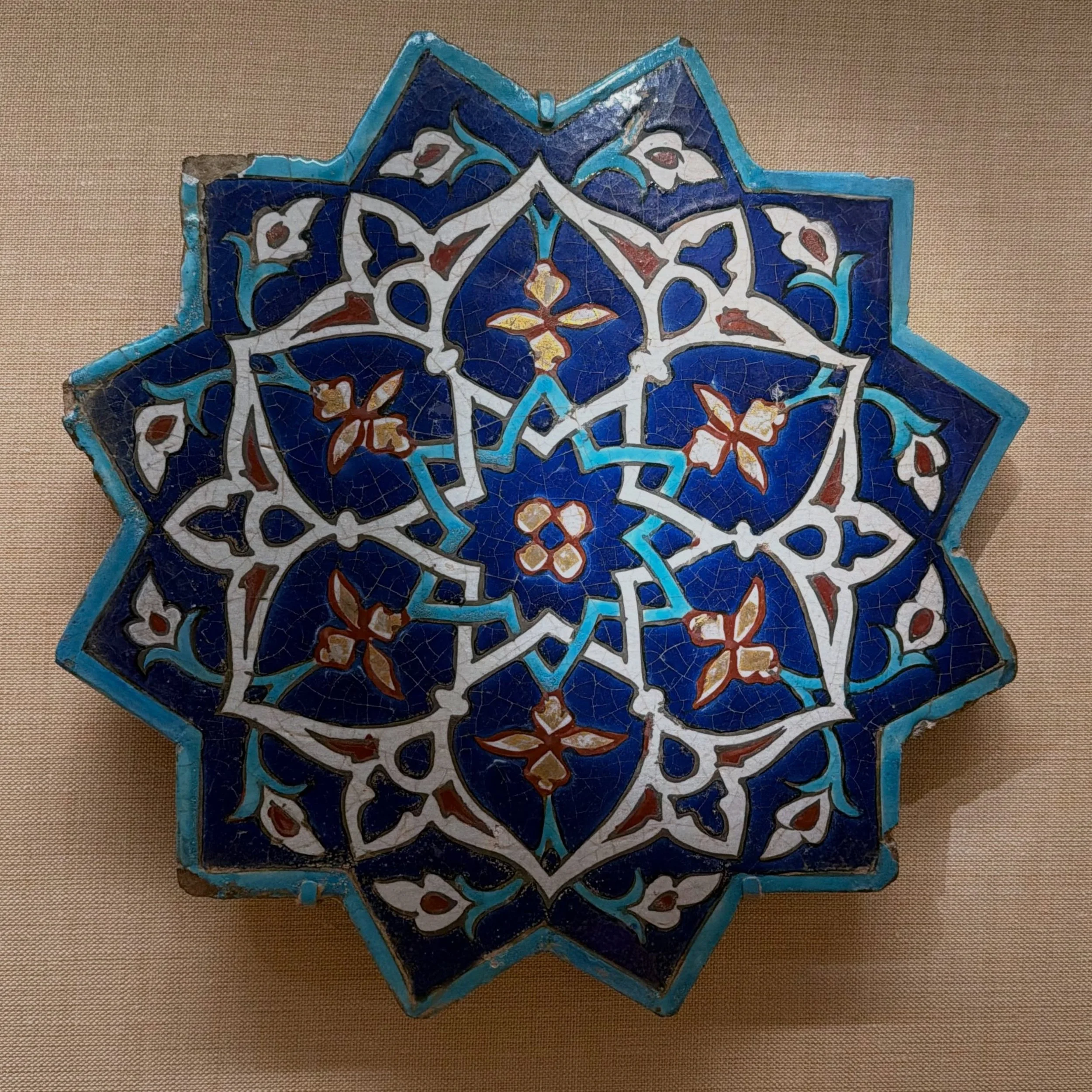 This exquisite tile was crafted during the Timurid period (1370-1507), and once graced the walls of the west iwan of the Madrasa al-Ghiyathiyya, a religious school in northeastern Iran.