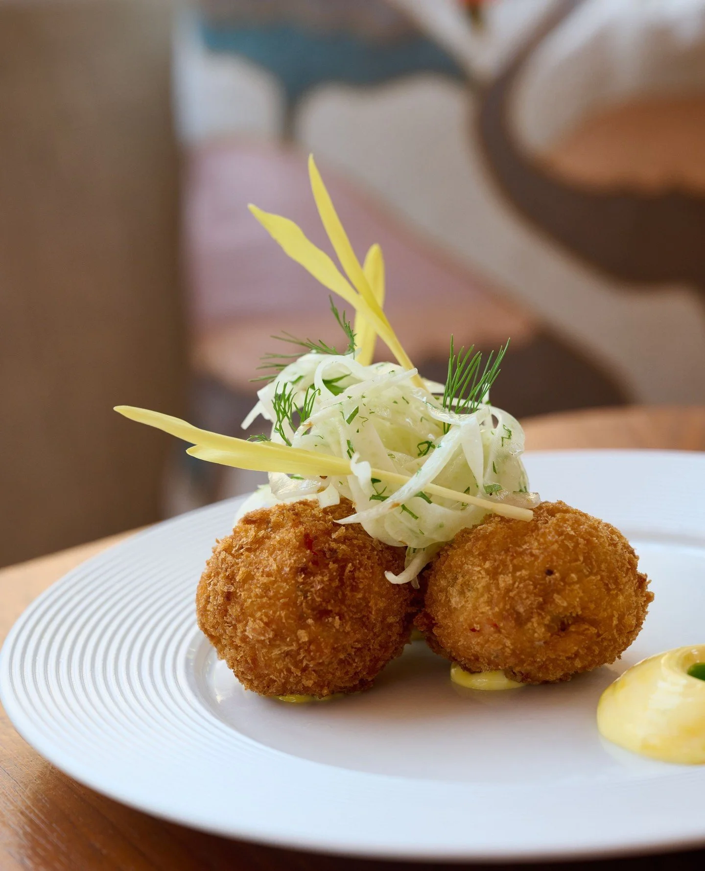 Golden and crisp on the outside, soft and rich on the inside. Our Crab and Lobster Croquettes are served with saffron aioli, herb oil, and a fresh fennel salad with apple and popcorn shoots. ⁠
⁠
⁠
#flamingoroomdubai #jumeirahalnaseem #dubairestaurant
