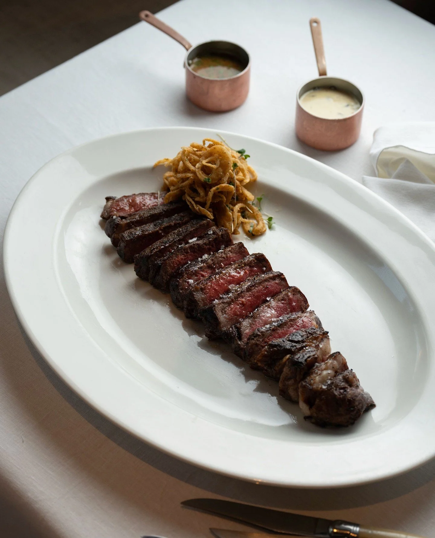 A refined take on a timeless favourite. Our Wagyu Striploin comes with au poivre or mushroom sauce, each one adding its own quiet depth to the dish.⁠
⁠
#flamingoroom #wagyustriploin #dubairestaurants