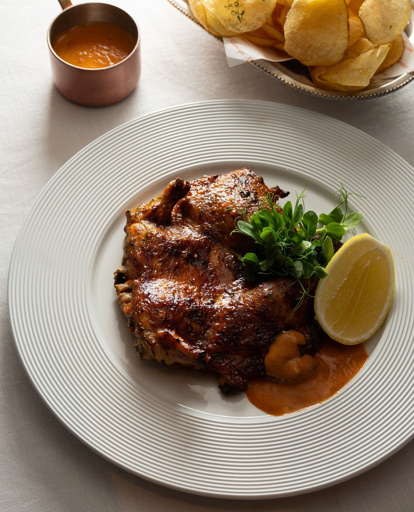 Our Peri-Peri Baby Chicken is marinated in a warm, flavourful peri-peri sauce, served with lemon, herbs and crisp potatoes.⁠
⁠
#flamingoroombytashas #jumeirahalnaseem #flamingoroomdubai #periperichicken
