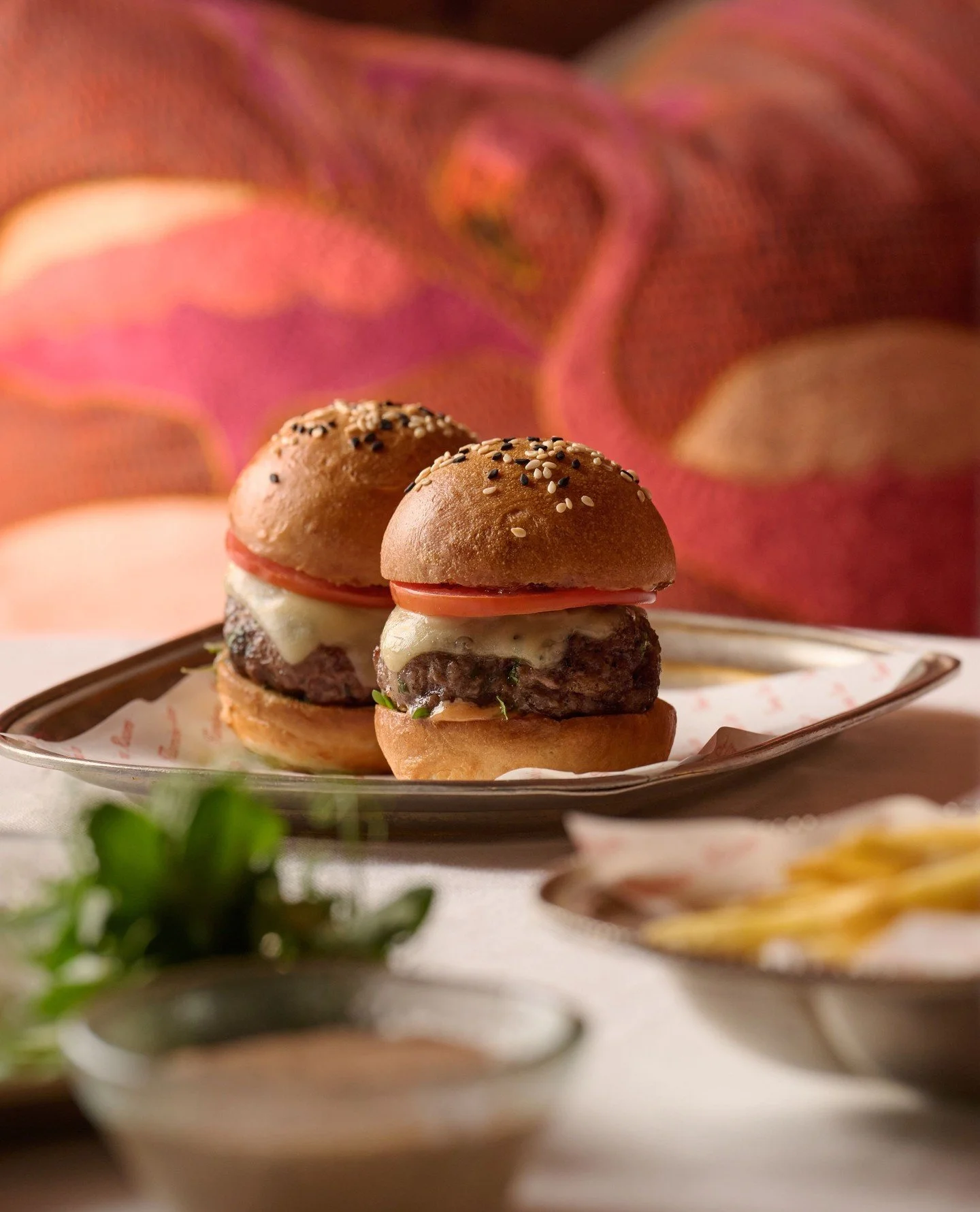 Emmental, veal bacon and onion jam, tomato and ranch layered over tender beef patties. Our Beef Sliders is a familiar favorite.⁠
⁠
#flamingoroombytashas #jumeirahalnaseem #flamingoroomdubai #beefslider