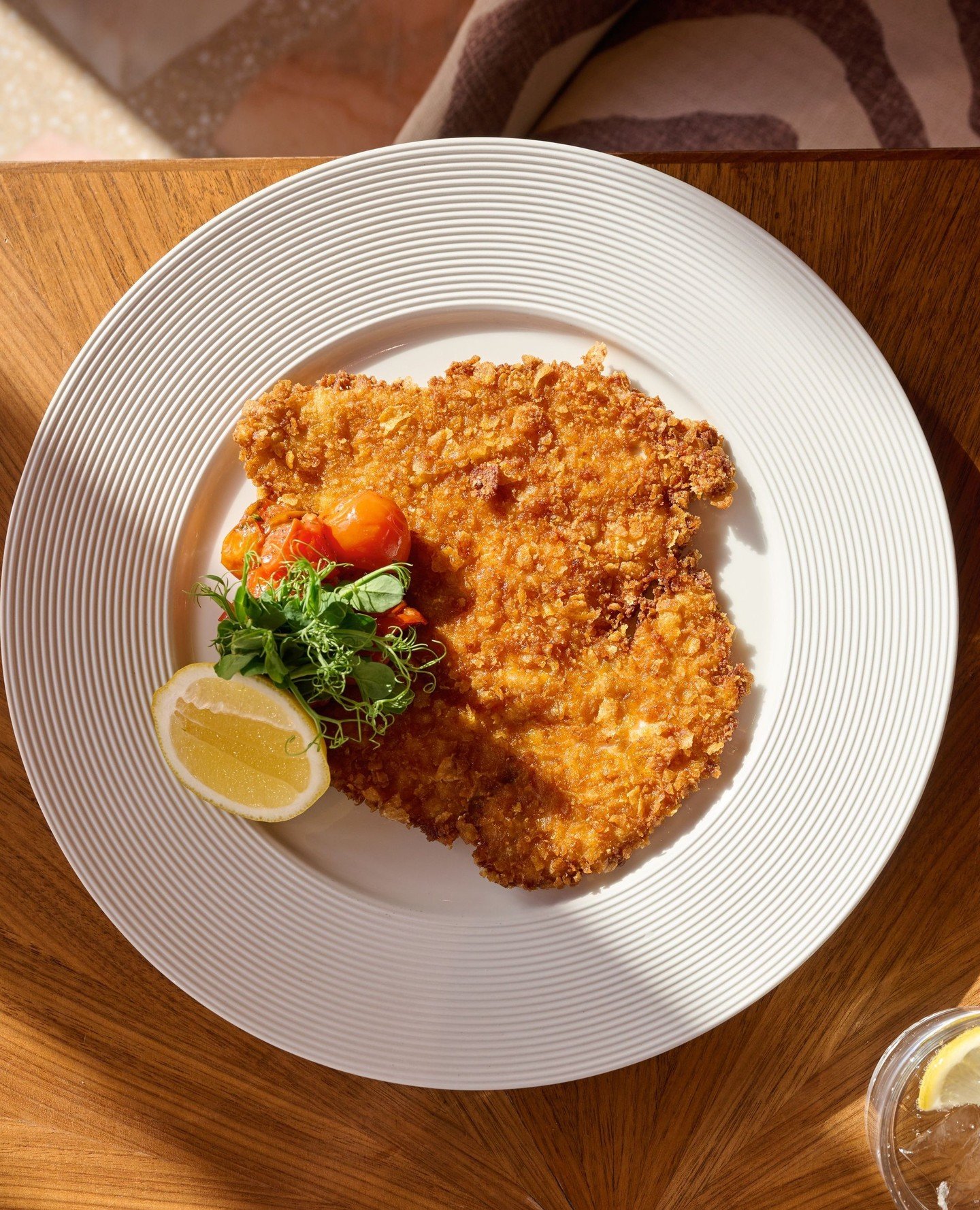 Cornflake Chicken Schnitzel.⁠
⁠
A classic from our menu, coated in a crisp cornflake crust and served with vine tomato salsa. Finished with a light, fresh balance of texture and flavour.⁠
⁠
Available every week on our Minuty Ros&eacute; Sunday set me