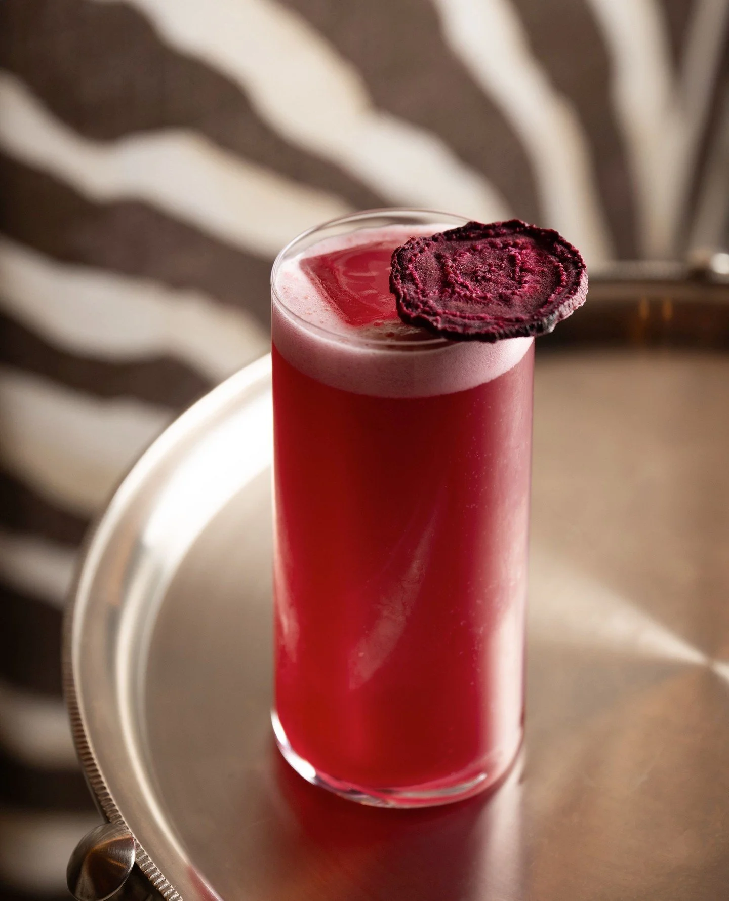 African Beet brings together bold beetroot, botanical gin and lychee in a signature cocktail that is earthy, fresh and quietly unexpected.⁠
⁠
A sunset hued gin cocktail, full of character and made for evenings at the bar.⁠
⁠
#flamingoroombytashas #co