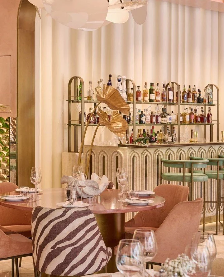 A glimpse of pink, brass finishes and a scalloped silhouette, some details are unmistakably Flamingo Room.⁠
⁠
Inspired by the colours and spirit of 1970s Miami, the space brings together playful details, from bronze meerkats and monkeys to hand blown