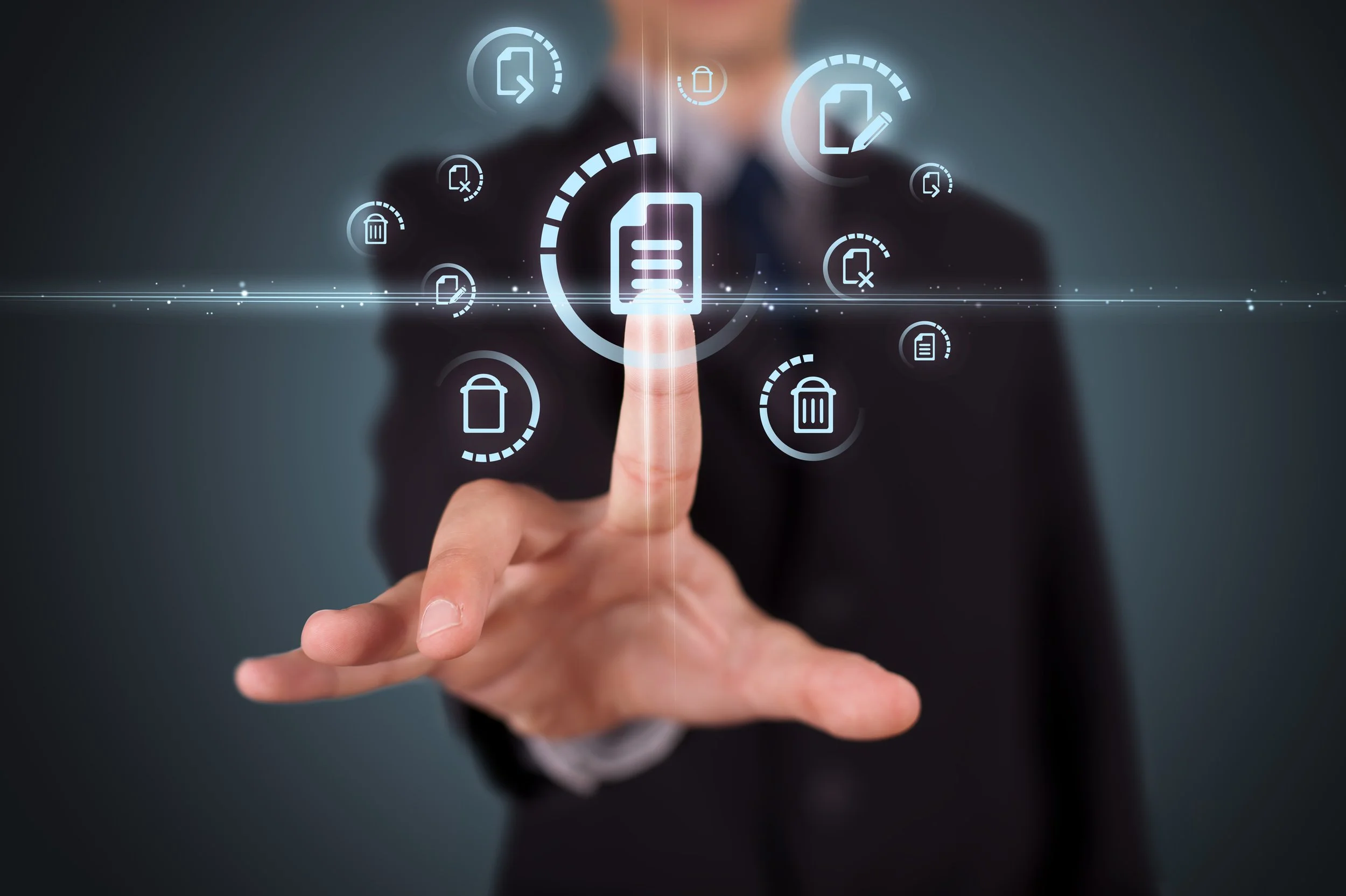 Person in business suit interacting with holographic icons related to documents and data management.