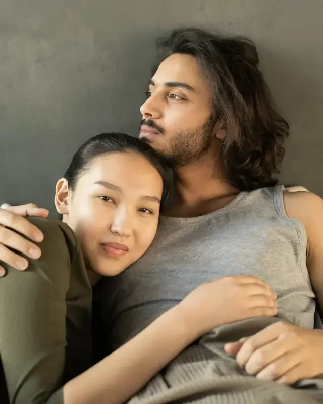 A mixed couple hugging