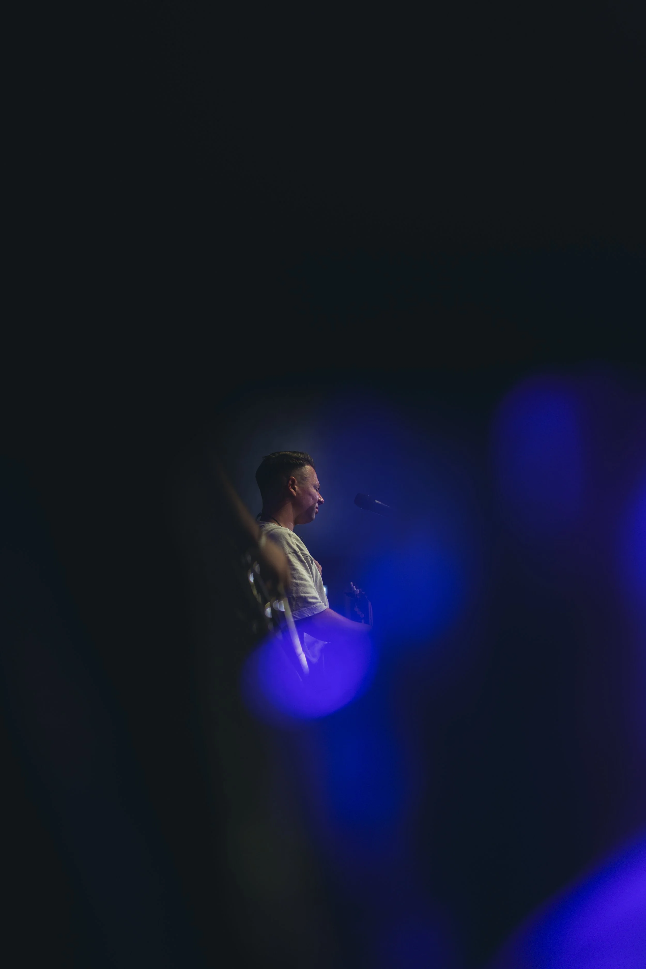 Shot utilising elements on stage to frame the subject