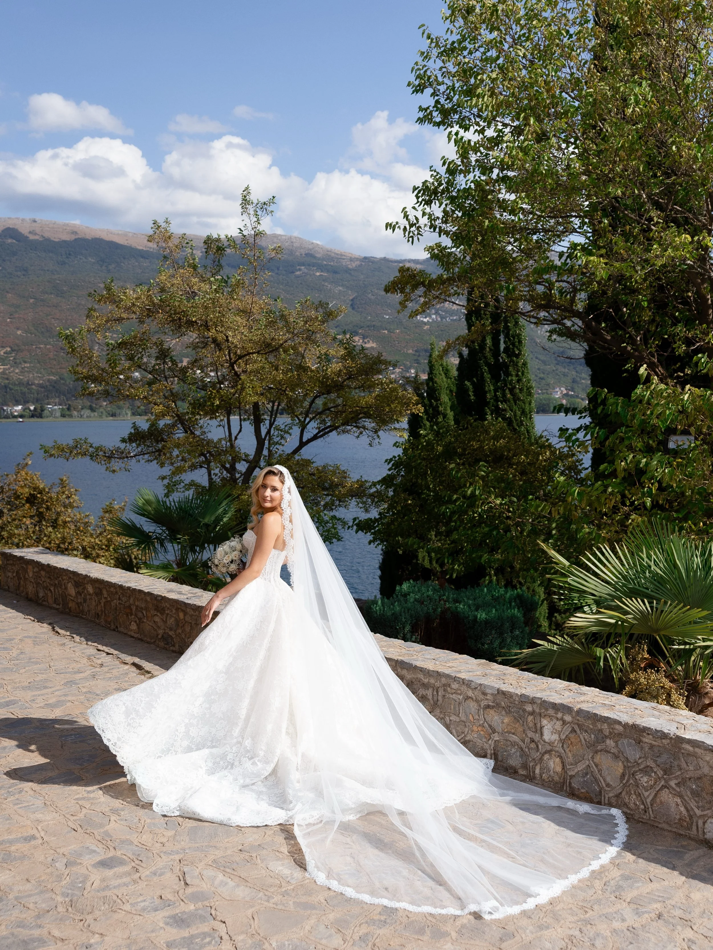 Katerina &amp; Dejan amongst the breathtaking backdrop of Lake Ohrid,Macedonia. 

Venue: @despina_event_venue_ohrid 
Wedding planner: @impactgroupevents 
Dress designer: @raffaeleciucabridal 
Shoes: @aminamuaddiofficial 
Hairstylist: @elitmarihairand
