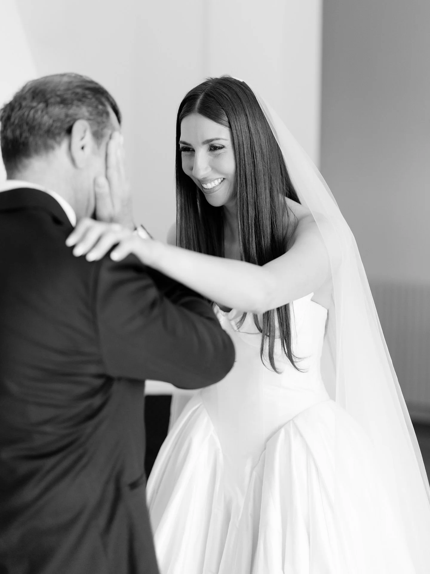 Black and white photo of Marilena and Joshua embracing